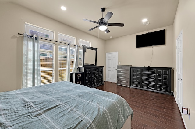 bedroom with dark wood-type flooring and ceiling fan