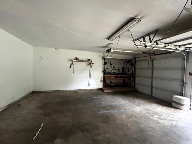 garage featuring a workshop area and a garage door opener