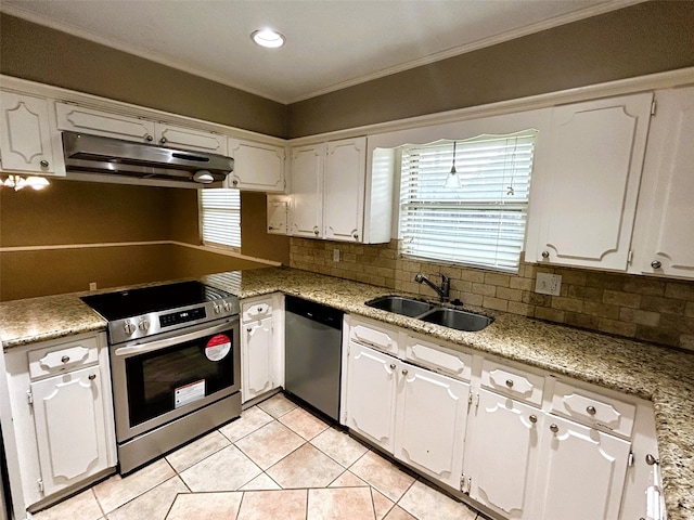 kitchen with light tile patterned flooring, crown molding, appliances with stainless steel finishes, sink, and white cabinets