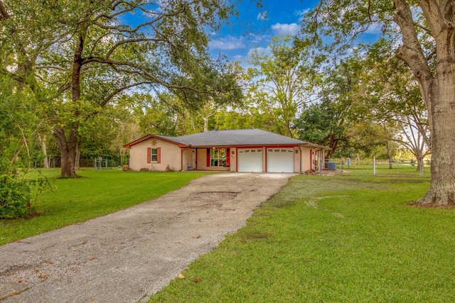 ranch-style house with a garage and a front lawn