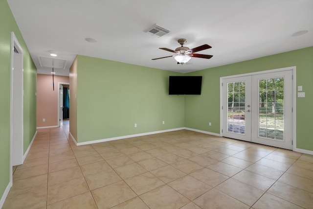 tiled empty room with french doors and ceiling fan