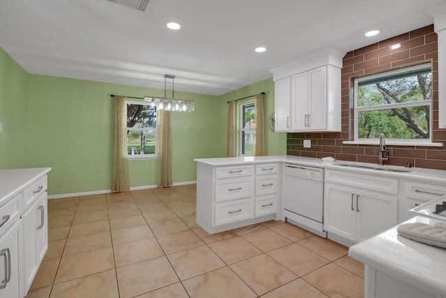 kitchen with dishwasher, white cabinetry, hanging light fixtures, and tasteful backsplash