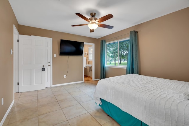 tiled bedroom with ceiling fan and ensuite bathroom