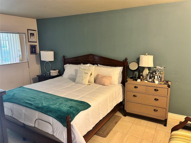 bedroom with light tile patterned floors