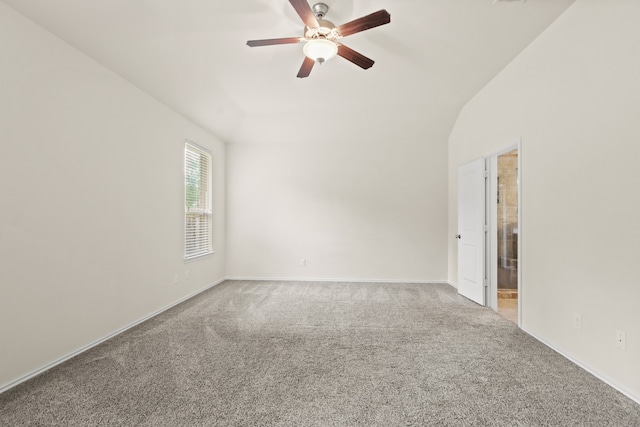 spare room featuring ceiling fan, carpet flooring, and lofted ceiling