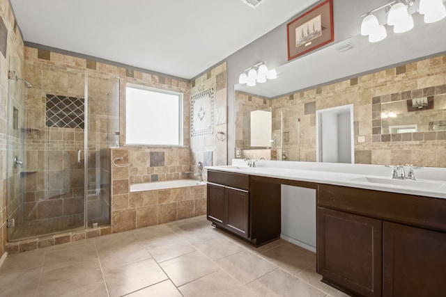 bathroom featuring vanity, tile patterned floors, separate shower and tub, and tile walls