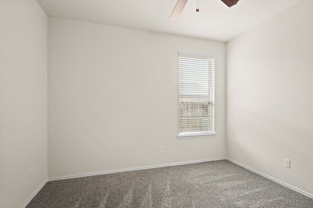 empty room with ceiling fan and carpet flooring