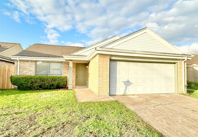 single story home with a garage and a front yard