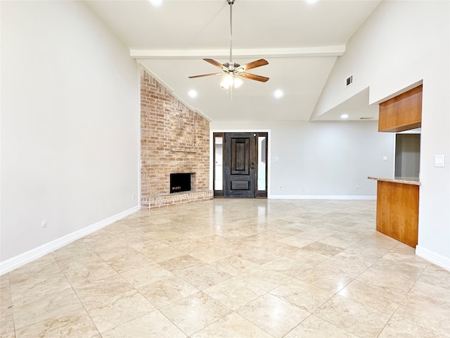 unfurnished living room with a fireplace, beam ceiling, high vaulted ceiling, and ceiling fan