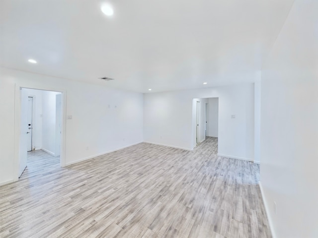 unfurnished room with light hardwood / wood-style flooring