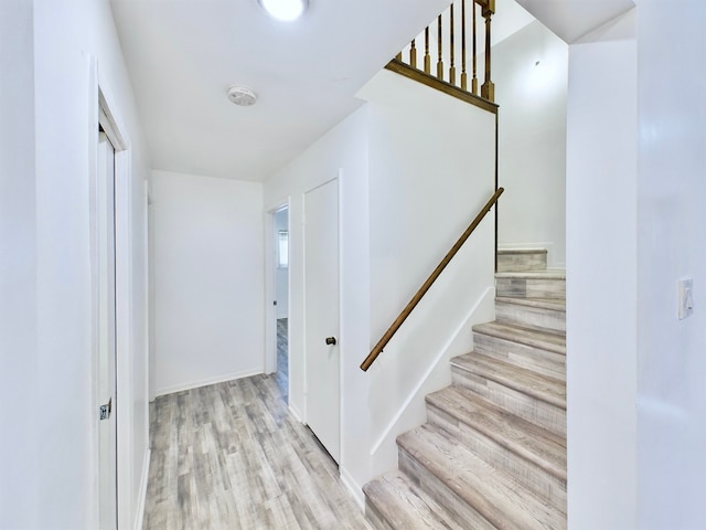 stairway featuring hardwood / wood-style flooring