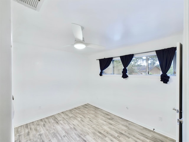 unfurnished room featuring ceiling fan and light wood-type flooring