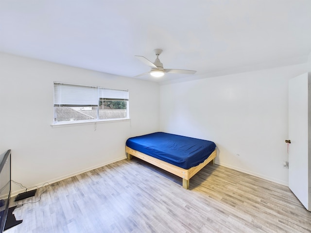 unfurnished bedroom with light wood-type flooring and ceiling fan