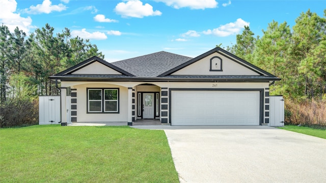 ranch-style house featuring a garage and a front yard