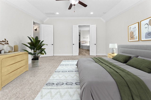 carpeted bedroom featuring vaulted ceiling, ensuite bath, ceiling fan, and ornamental molding