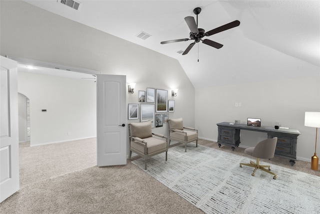 carpeted office with vaulted ceiling and ceiling fan