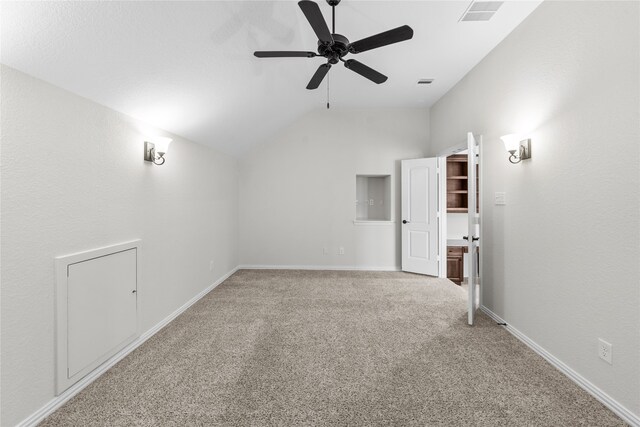 unfurnished room with carpet flooring, ceiling fan, and vaulted ceiling