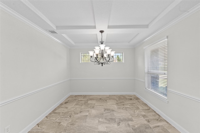 spare room featuring a chandelier, plenty of natural light, and crown molding