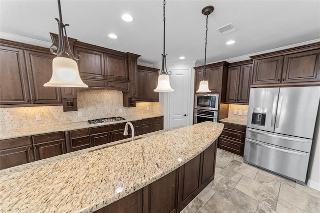 kitchen with light stone countertops, tasteful backsplash, decorative light fixtures, dark brown cabinets, and appliances with stainless steel finishes