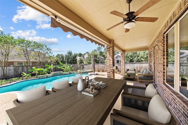 view of patio / terrace with an outdoor living space, a fenced in pool, and ceiling fan