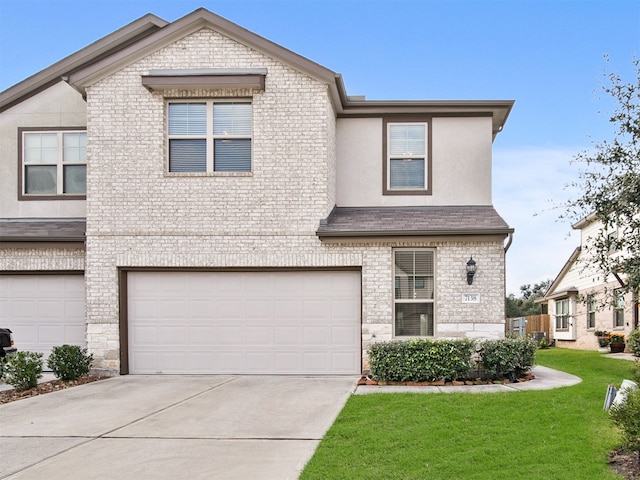 view of front facade with a garage and a front yard