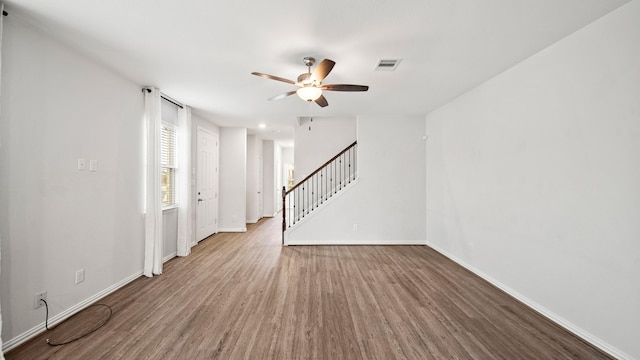 spare room featuring hardwood / wood-style floors and ceiling fan