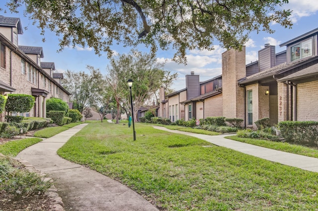 view of community featuring a lawn