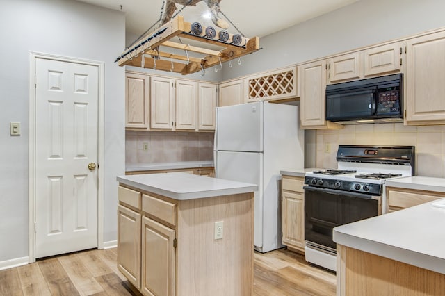 kitchen featuring backsplash, white appliances, light wood-type flooring, and a kitchen island