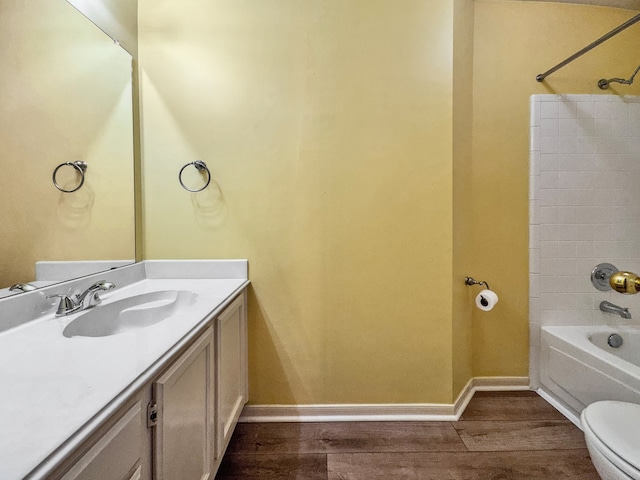 full bathroom with toilet, shower / tub combination, vanity, and hardwood / wood-style floors