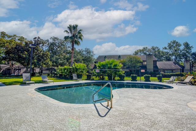 view of pool featuring a patio