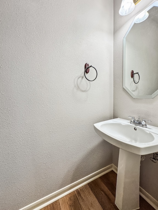 bathroom with sink and hardwood / wood-style floors