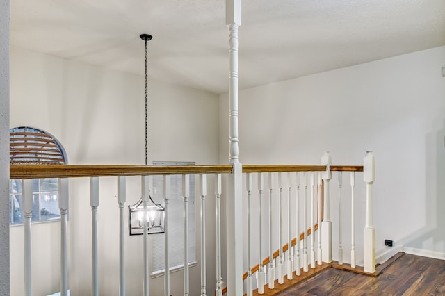 details featuring hardwood / wood-style flooring and an inviting chandelier