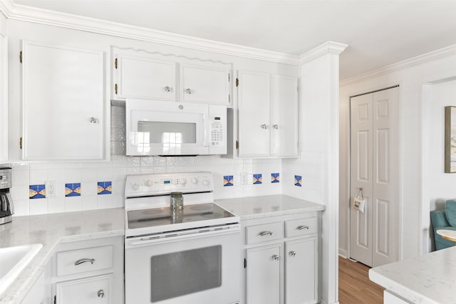 kitchen with white cabinets, crown molding, backsplash, light hardwood / wood-style flooring, and white appliances