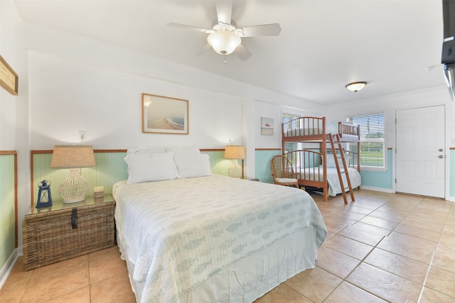 bedroom with light tile patterned flooring and ceiling fan