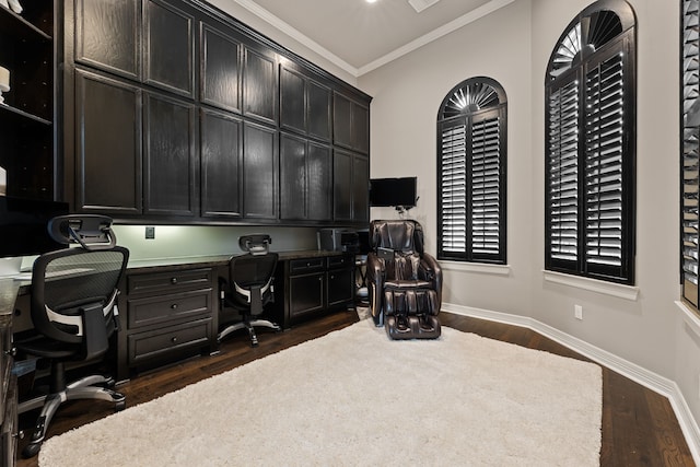 office space featuring built in desk, dark hardwood / wood-style floors, and ornamental molding