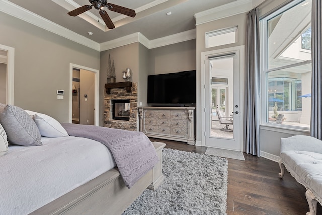 bedroom with multiple windows, dark hardwood / wood-style flooring, access to outside, and ceiling fan