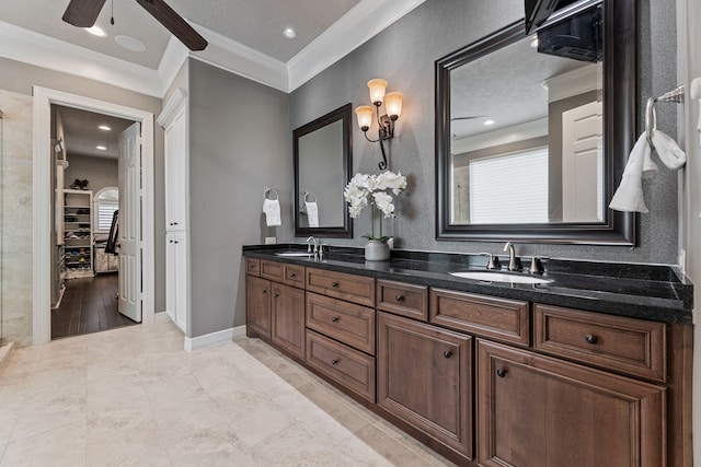 bathroom with crown molding, vanity, wood-type flooring, and ceiling fan