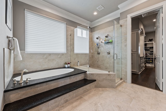 bathroom with crown molding and plus walk in shower