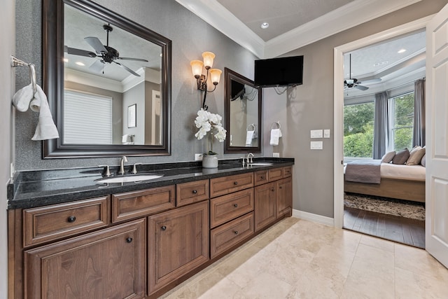 bathroom featuring hardwood / wood-style floors, vanity, and crown molding