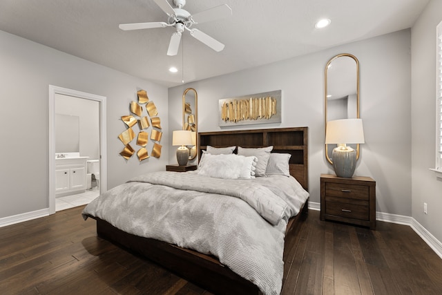 bedroom with connected bathroom, dark hardwood / wood-style floors, and ceiling fan