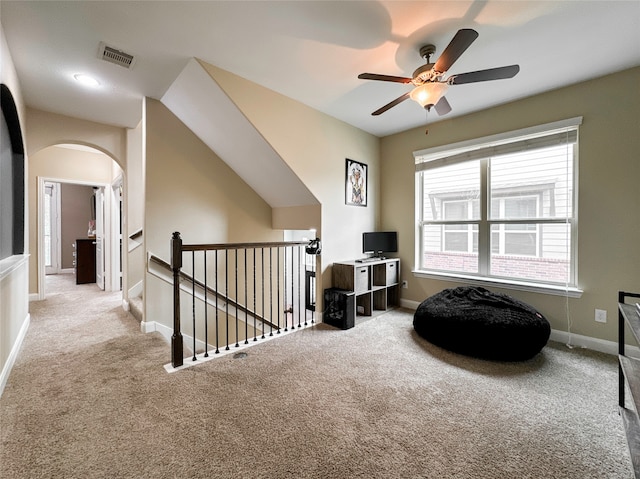 sitting room with ceiling fan and light carpet