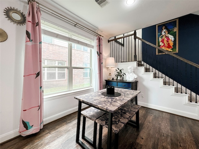 dining room with dark hardwood / wood-style floors