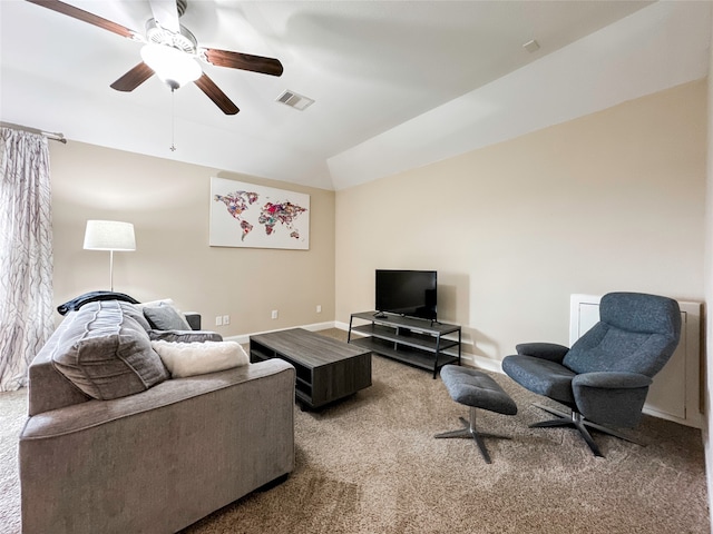 carpeted living room featuring vaulted ceiling and ceiling fan