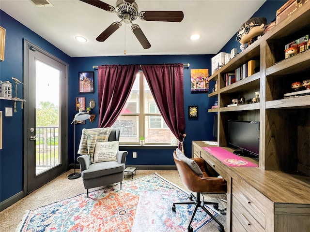 home office featuring ceiling fan and light colored carpet