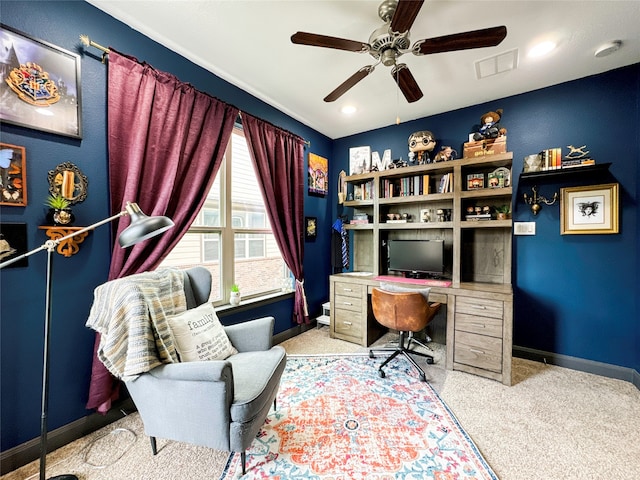 office space featuring light colored carpet and ceiling fan