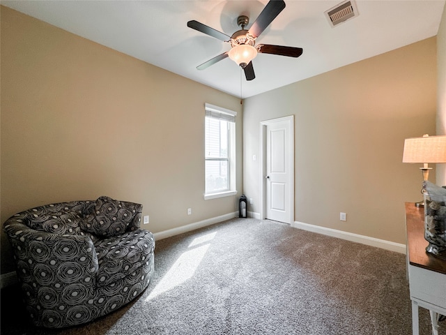 living area with ceiling fan and carpet floors