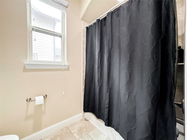 bathroom with tile patterned floors and a shower with curtain