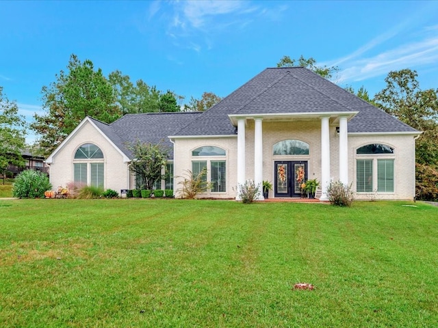 view of front facade featuring french doors and a front lawn