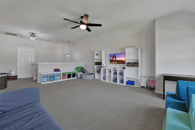 living room featuring carpet floors, ceiling fan, and vaulted ceiling