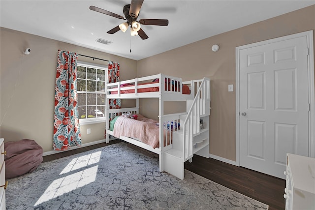 bedroom featuring ceiling fan and dark hardwood / wood-style floors